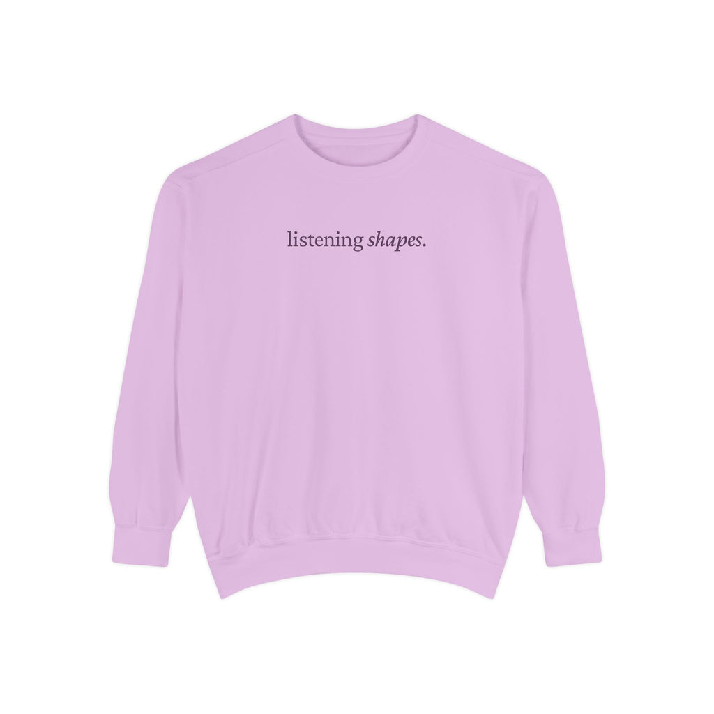 Light purple sweatshirt with 'listening shapes' text on a white background