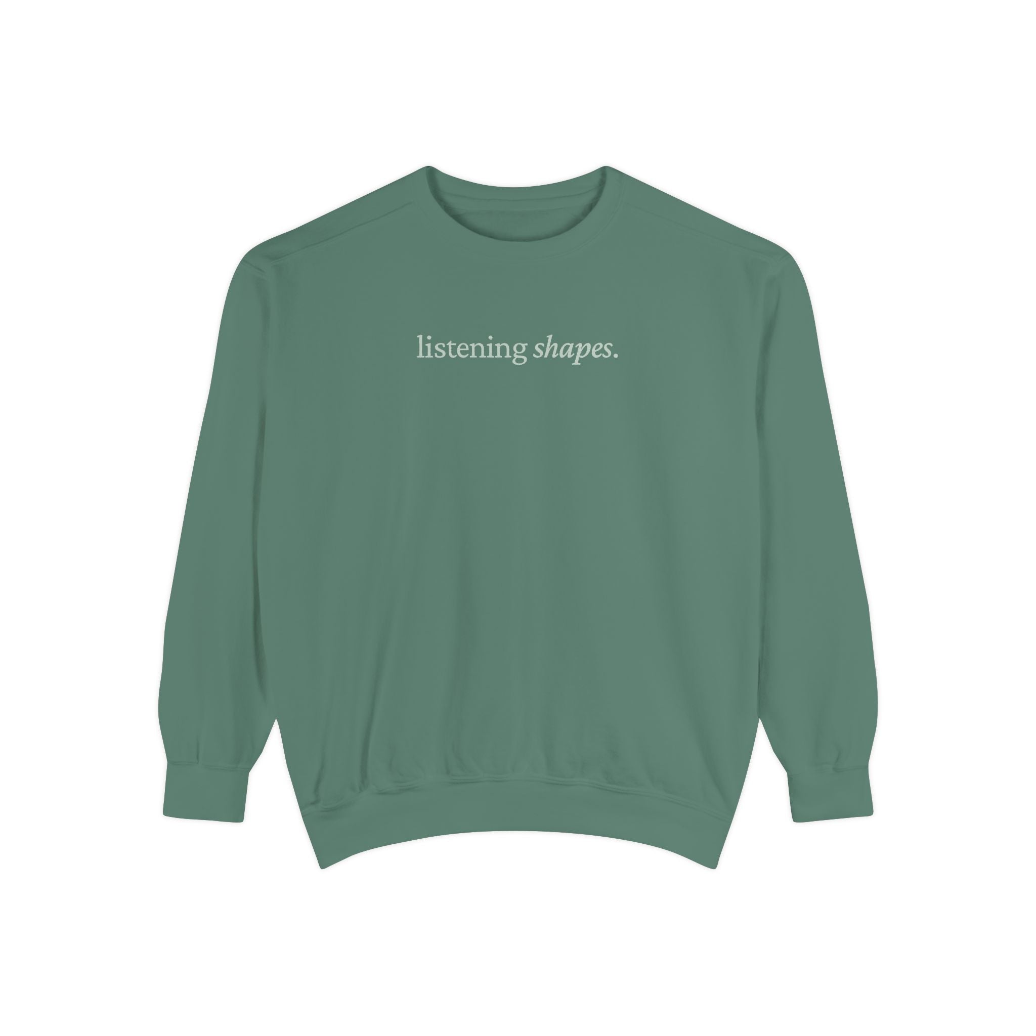 Green sweatshirt with 'listening shapes' text on a white background